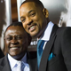 Dr. Bennett Omalu and actor Will Smith, who portrays him in Concussion, attend a special screening of the film in Westwood, Calif., Nov. 23, 2015.
VALERIE MACON/AFP/Getty Images